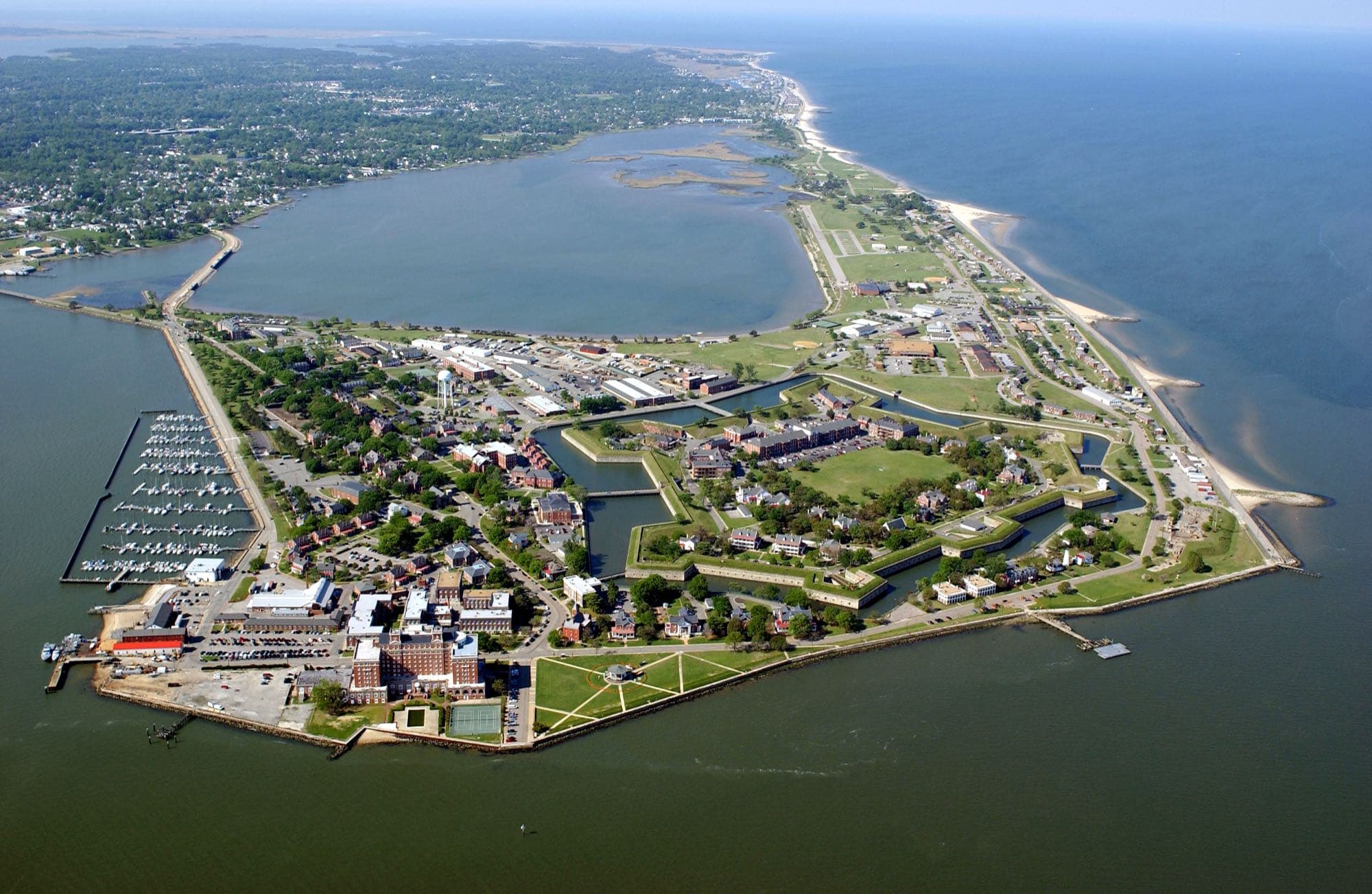 Aerial view of Fort Monroe, Hampton, Virginia, showing the fort grounds and surrounding waterfront piers